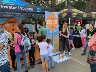 Photo of crowd gathering around Stormwater booth